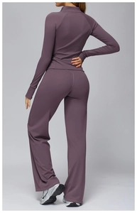 Rear view of brushed yoga set showing zip-up jacket and wide-leg high-waist pants