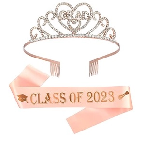 Close-up of pink satin sash with Class of 2023 gold text and rhinestone GRAD tiara