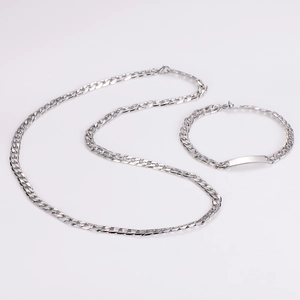 Detail of silver 7mm stainless steel flat Cuban link necklace and ID bracelet set