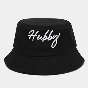 Detail of black cotton bucket hat featuring white Hubby script embroidery for couples