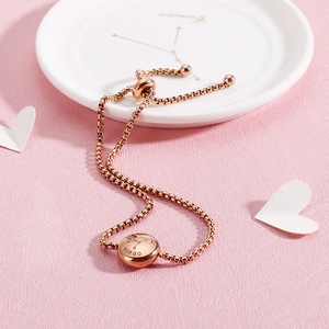 Detail of rose gold Virgo zodiac bracelet with adjustable sliding clasp and crystal