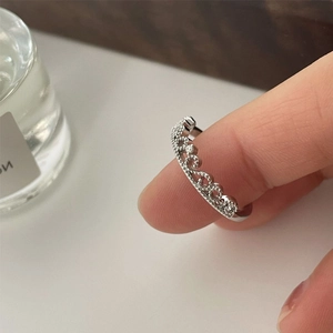 Elegant silver crown open ring with zircon stones shown on finger for a stylish look