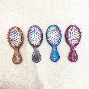 Portable mini glitter hairbrush set with air cushion massage in four vibrant colors
