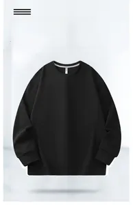 Close-up of crewneck sweatshirt showing cotton blend texture and ribbed cuff details