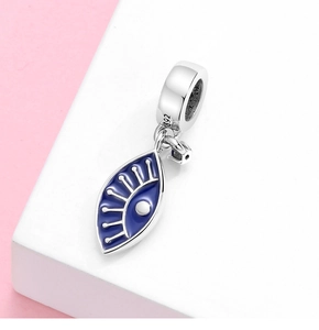 Macro shot of S925 sterling silver Evil Eye charm with blue enamel and zircon detail