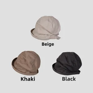 Linen bucket hats in beige, khaki, and black featuring classic stitched brim detailing