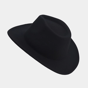 Close-up of high-quality black wool felt texture on a stylish fedora cowboy hat
