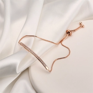 Detailed shot of rose gold bar bracelet with zircons and adjustable slider clasp