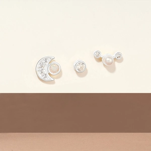 Detailed set of 3 sterling silver stud earrings with pearl, opal and moon designs