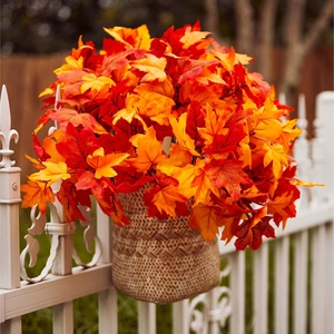 Artificial maple leaf branches in woven basket for autumn farmhouse table decor