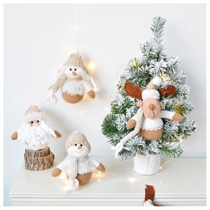 Detail of plush Christmas hanging ornaments featuring Santa, snowman, and reindeer