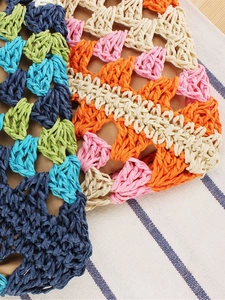 Colorful handmade crochet paper rope tote bag with vibrant striped woven texture