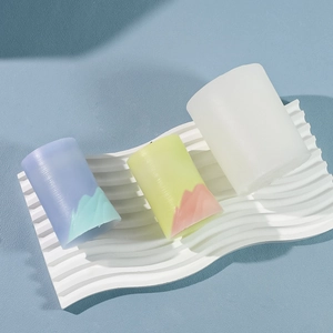Macro detail of alpine mountain candle molds with colorful geometric gradient design