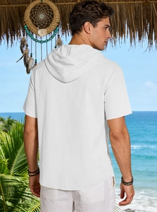 Rear view of white men's hooded linen shirt with curved hem against tropical beach setting