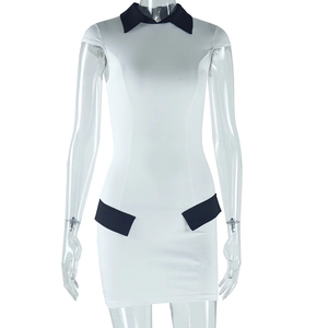 Detail of white slim fit dress with navy blue contrast collar and waist accents