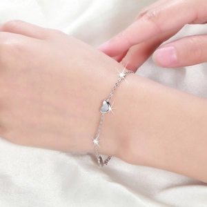 Elegant s925 sterling silver heart bead bracelet on white silk for women minimalist style