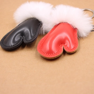 Faux leather heart keychain set in red and black with white plush pom pom accessories