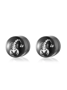 Close-up of black punk stud earrings featuring a bold white scorpion motif and polished finish