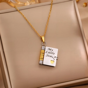 Golden and silver envelope locket necklace engraved with My Little Star on jewelry box
