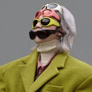 Detailed view of colorful Y2K steampunk sunglasses in white pink yellow and black