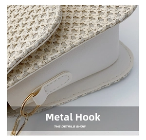 Macro shot of white woven texture and premium gold metal hardware on crossbody bag