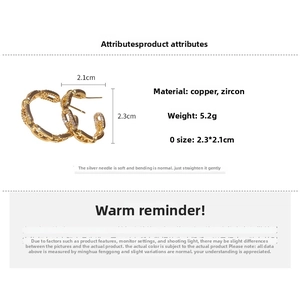 Detail showing dimensions and material of gold-plated chain earrings with cubic zirconia