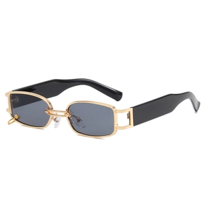 Fashionable rectangle sunglasses with gold metal frame and ring detail on white background