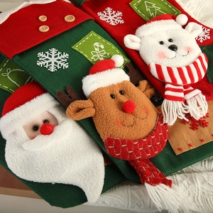 Christmas stockings featuring Santa Claus, reindeer, and polar bear plush doll decorations