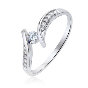 Elegant silver copper ring featuring a sparkling zircon stone and crisscross diamond band