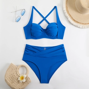 Close-up of royal blue high waisted bikini with criss-cross straps and pleated waist detail