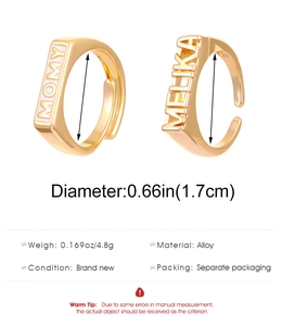 Detail showing adjustable MOMY and MELIKA letter rings with 1.7cm diameter measurements
