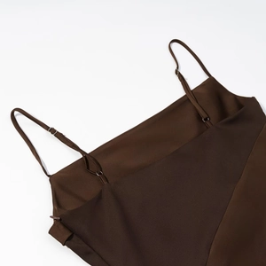 Detailed view of brown satin camisole top with adjustable thin shoulder straps
