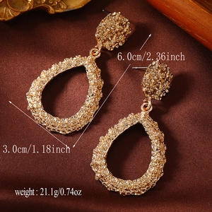 Detail view of retro gold drop earrings with dimensions 6.0cm by 3.0cm and weight info