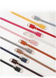 Detailed display of colorful slim belts for women with elegant golden horseshoe buckles