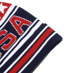 Detailed close-up of knitted USA beanie showing intricate stars and stripes jacquard pattern