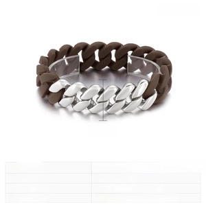 Detail of 21mm gold-plated stainless steel Cuban link mixed with brown silicone strap