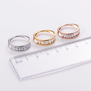 Minimalist rhinestone rings in gold and silver finish shown with a metric ruler scale