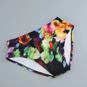 Close-up of high-waisted bikini bottoms with vibrant abstract floral print on fabric