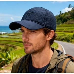 Close-up of navy blue quilted baseball cap with ear protection for outdoor winter warmth