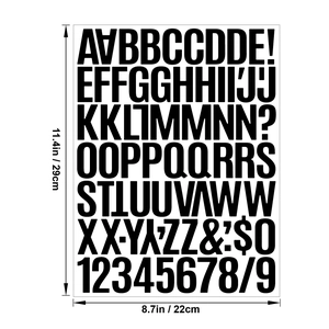 Detailed view of 1.5 inch black vinyl alphabet and number stickers on a 11.4x8.7 inch sheet