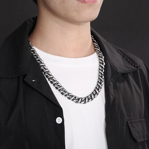 Mens minimalist silver stainless steel Cuban link chain necklace worn by a model