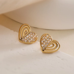 Gold-plated heart stud earrings with cubic zirconia on a minimalist stone base