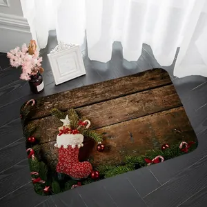 Detail of vintage Christmas floor mat with festive stocking print on dark wood floor