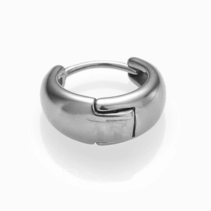 Close-up detail of polished silver twist hoop earrings in high-grade stainless steel