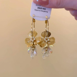 Gold plated floral hoop earrings with sparkling cubic zirconia and aurora crystal teardrops