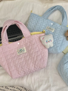 Quilted heart pattern tote bag in pink and blue with plush bear charm and snap closure
