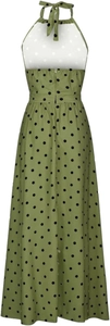 Detail of green halter neck dress with black polka dots featuring backless design