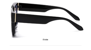 Ninety-degree side view of black square frames featuring golden metal hinge details