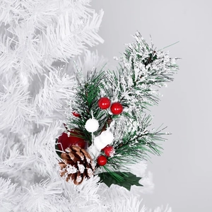 Artificial Christmas pine branch with red berries and snow-covered pine cones on a tree