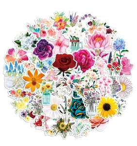 Close-up of waterproof sunflower and bee stickers with vibrant floral designs for luggage